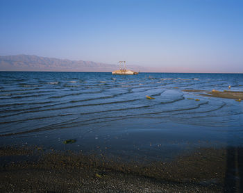 Scenic view of sea against clear sky
