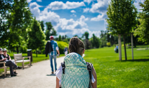 Rear view of woman walking in park