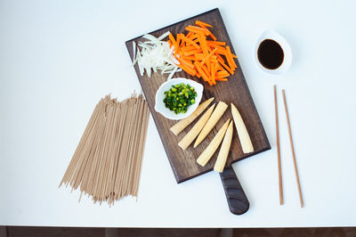 High angle view of food on table against white background