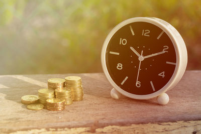 Close-up of clock on table