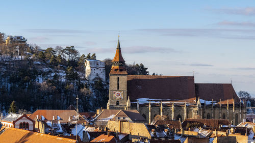 Buildings in city against sky