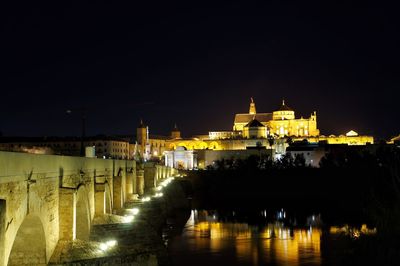 Illuminated buildings in city at night