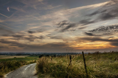 Scenic view of landscape against cloudy sky