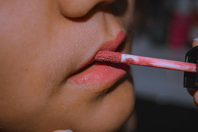 Close-up of woman making face outdoors