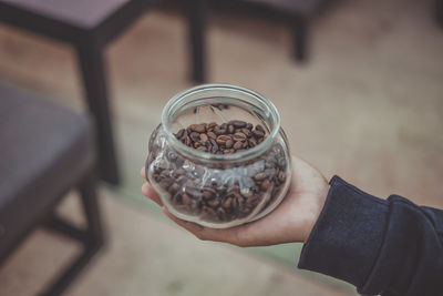 Cropped hand holding coffee