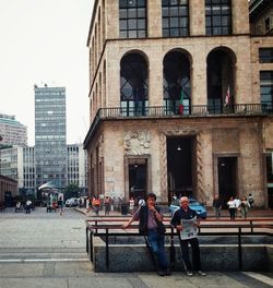 People in front of building