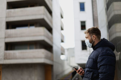 Side view of man wearing face mask