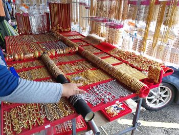 High angle view of man holding red sale