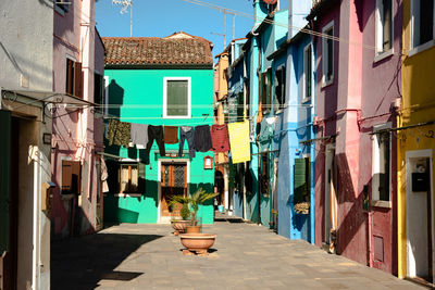 Alley amidst buildings in city