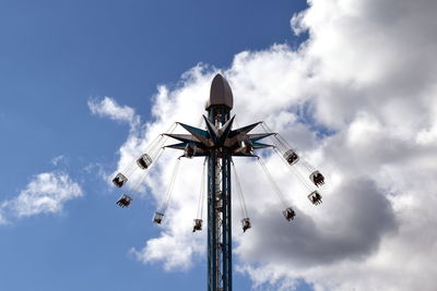 Low angle view of amusement park ride against sky