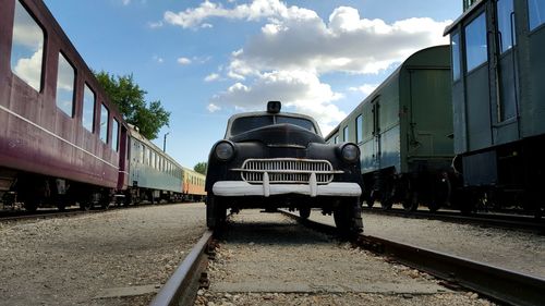 Train on railroad track against sky