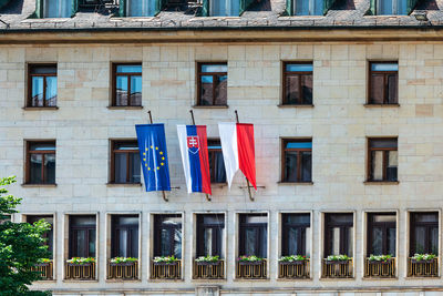 Flags against building in city