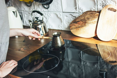 Midsection of woman preparing food on table