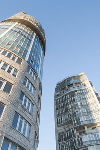 Low angle view of modern buildings against clear sky