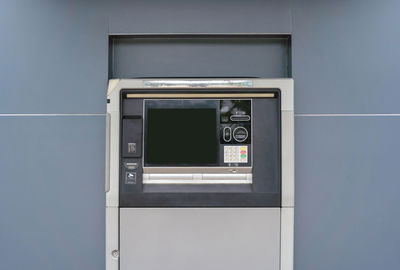 Close-up of telephone booth on wall