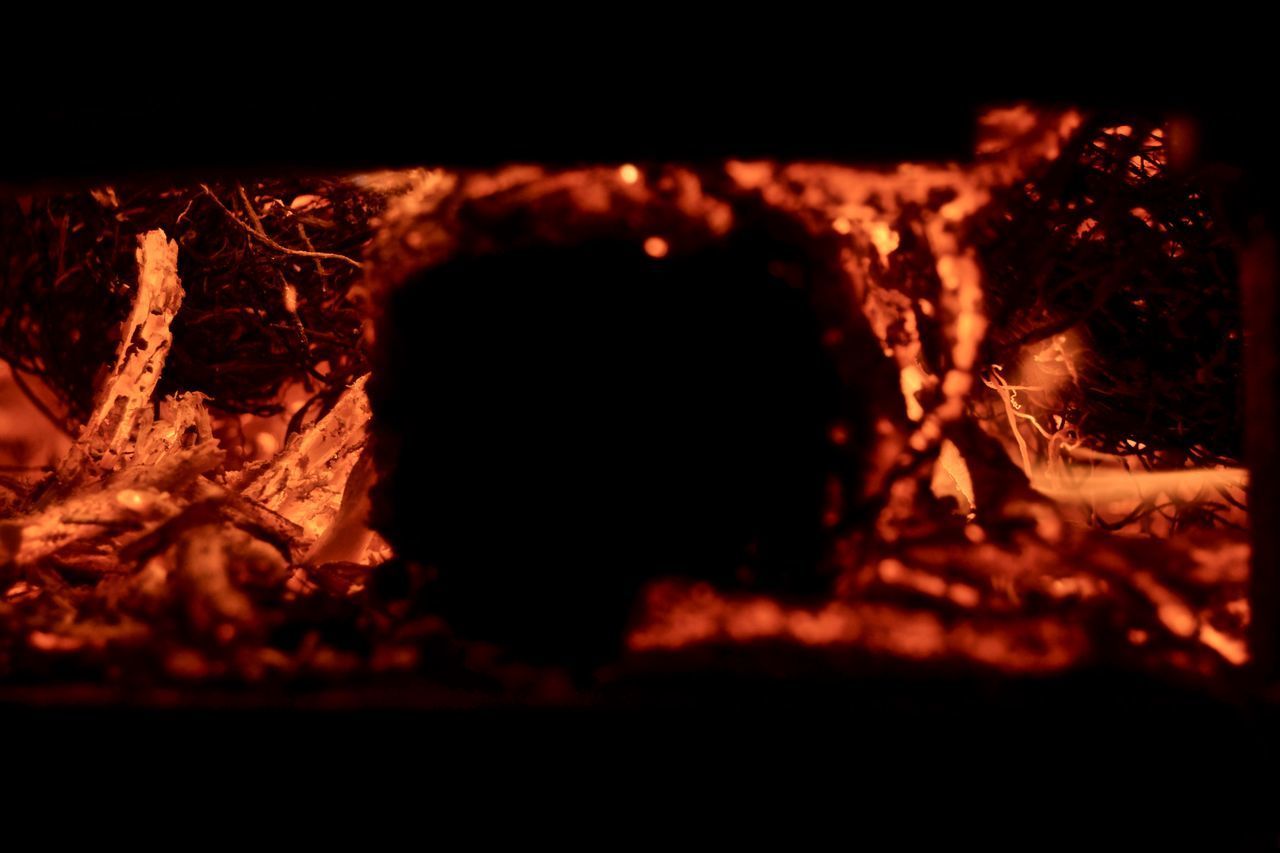 CLOSE-UP OF FIRE IN THE DARK