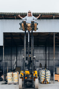 Man standing in front of built structure