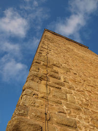 Low angle view of built structure against blue sky