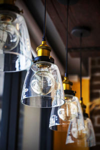 Low angle view of pendant lights in restaurant