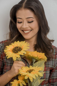 Portrait of smiling woman with yellow eyes