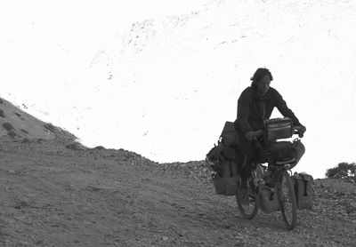 Man riding motorcycle on field