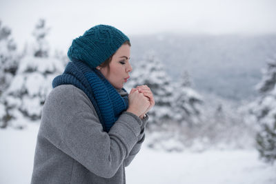Young woman wearing hat during winter