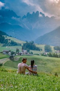 Women on field against mountains