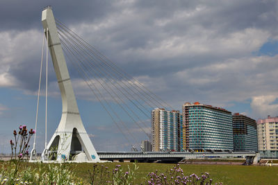 Low angle view of bridge against cloudy sky