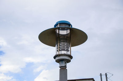 Low angle view of communications tower against sky