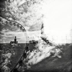 Silhouette of woman against cloudy sky