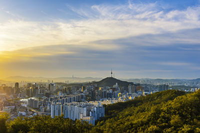 High angle view of buildings against sky during sunset