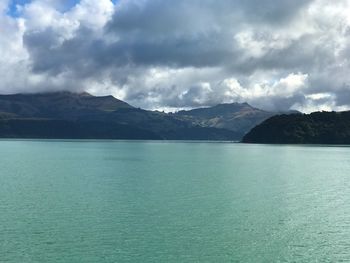 Scenic view of sea against cloudy sky