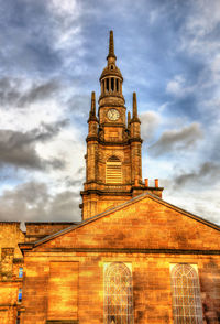 Low angle view of clock tower against sky