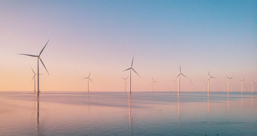 Scenic view of sea against clear sky during sunset