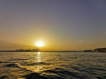 Scenic view of sea against sky during sunset