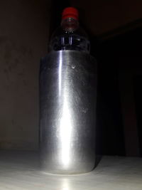 Close-up of water bottle on table