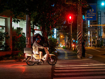 Cars parked on road at night