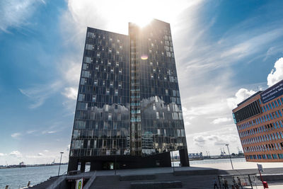 Low angle view of modern buildings against sky in city