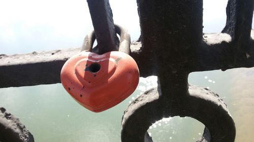 Close-up of padlocks hanging on metal