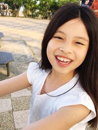 Portrait of smiling girl at park