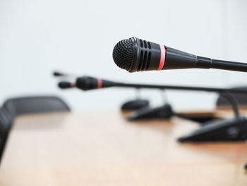 Close-up of microphones on table