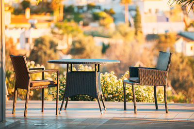 Empty chairs and tables in restaurant