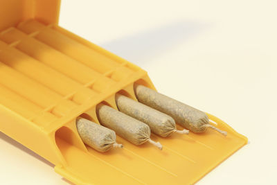 High angle view of cigarette on white background