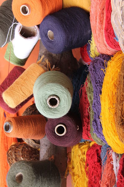 Close-up of colorful threads on table