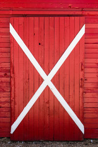 Cross shape on closed wooden barn door