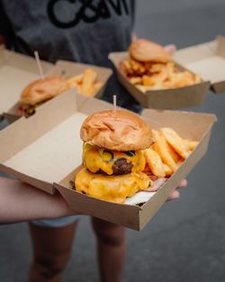 Close-up of hand holding burger
