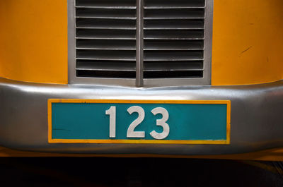 Number 123 on yellow bus