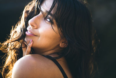Young latina woman portrait at golden hour in summertime