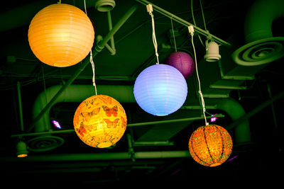 Low angle view of balloons hanging on pole