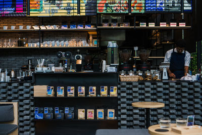 Full frame shot of bottles on display at store